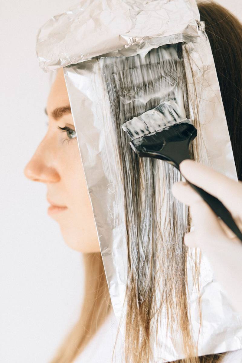 Close-up of foils and a color brush during highlights