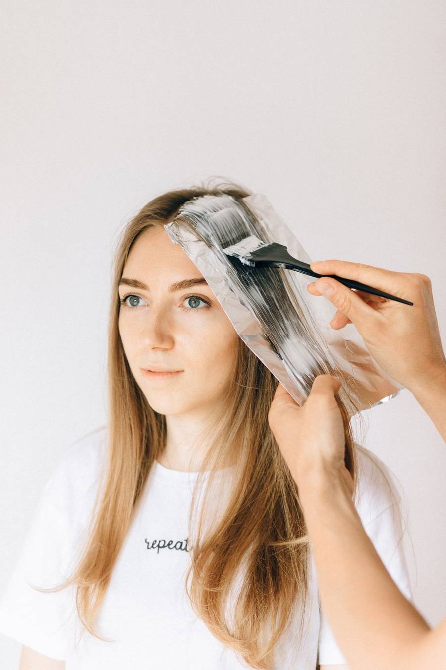 Color being painted onto a foil section during a highlight
