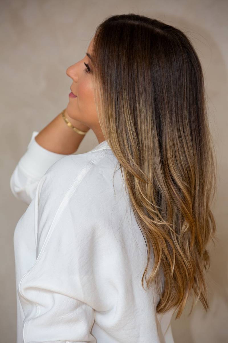 Long, glossy brunette hair with soft lived-in color